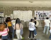 Job seekers attending a recruitment job fair hosted by an accredited Philippine recruitment agency offering overseas employment opportunities.